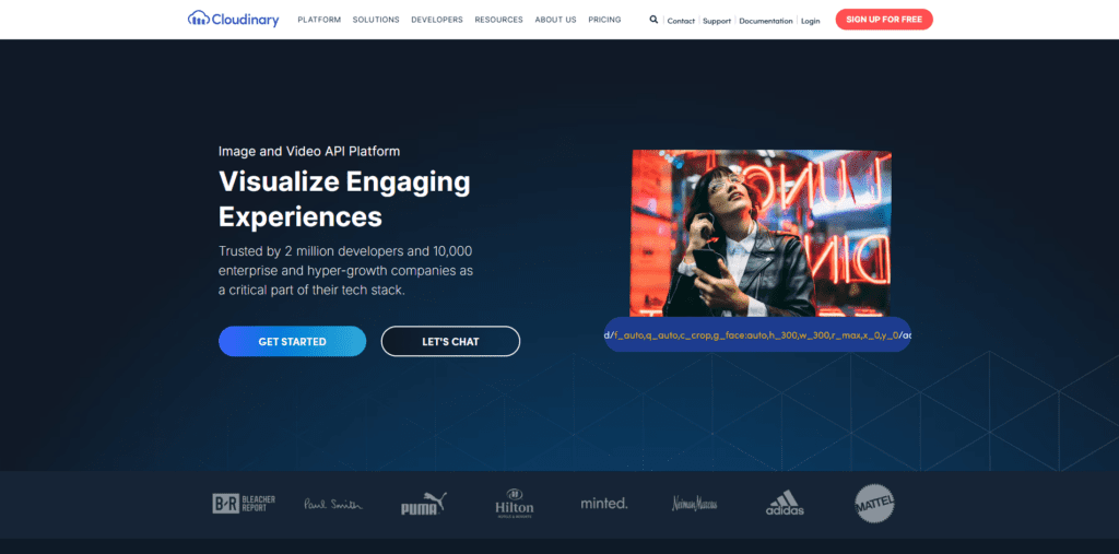 Cloudinary homepage featuring its image and video API platform with the headline 'Visualize Engaging Experiences' and CTA buttons.