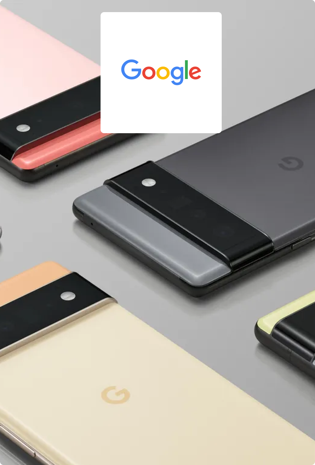 Four Google Pixel phones in various colour schemes laid out on a desk.